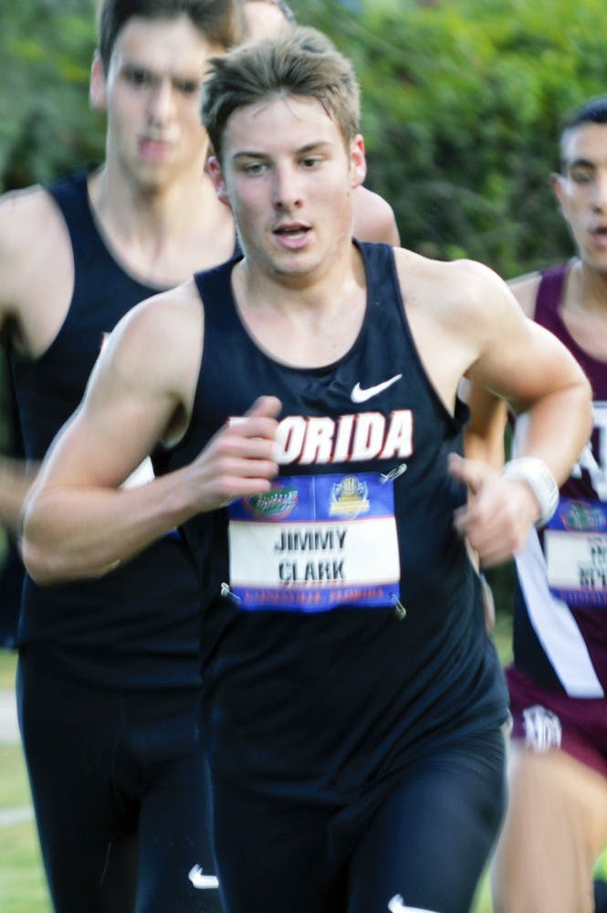 Jimmy Clark races during the 2013 Southeastern Conference Cross Country Championships at the Mark Bostick Golf Course