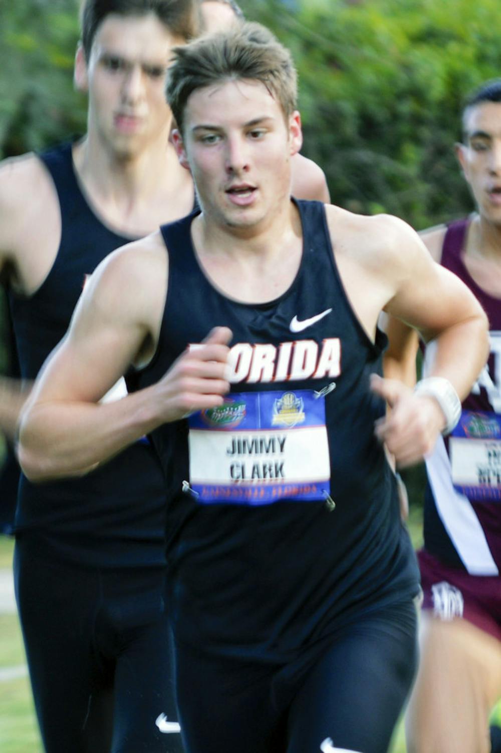 <p>Jimmy Clark races during the 2013 Southeastern Conference Cross Country Championships at the Mark Bostick Golf Course</p>