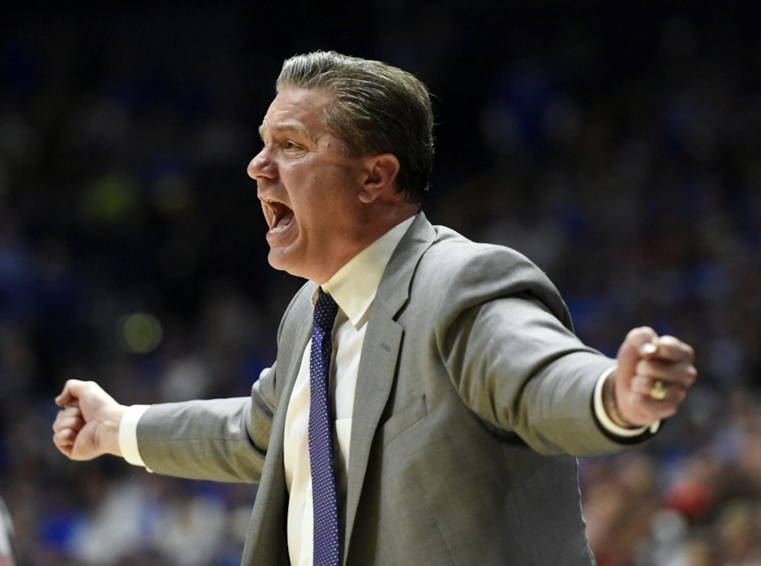 Kentucky head coach John Calipari yells to his players in the second half of an NCAA college basketball game against Arkansas for the championship of the Southeastern Conference tournament Sunday, March 12, 2017, in Nashville, Tenn. Kentucky won 82-65. (AP Photo/Sanford Myers)