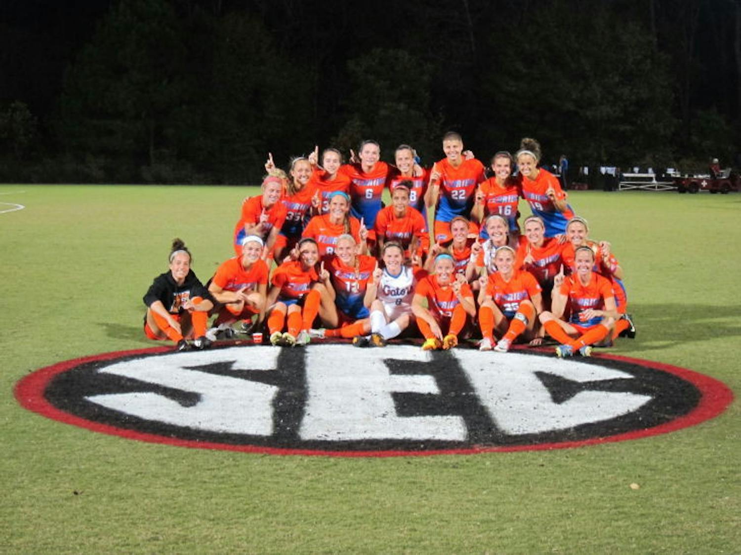 The Florida soccer team celebrates after winning a share of the Southeastern Conference with its 5-1 win against Georgia on Thursday night in Athens, Ga.