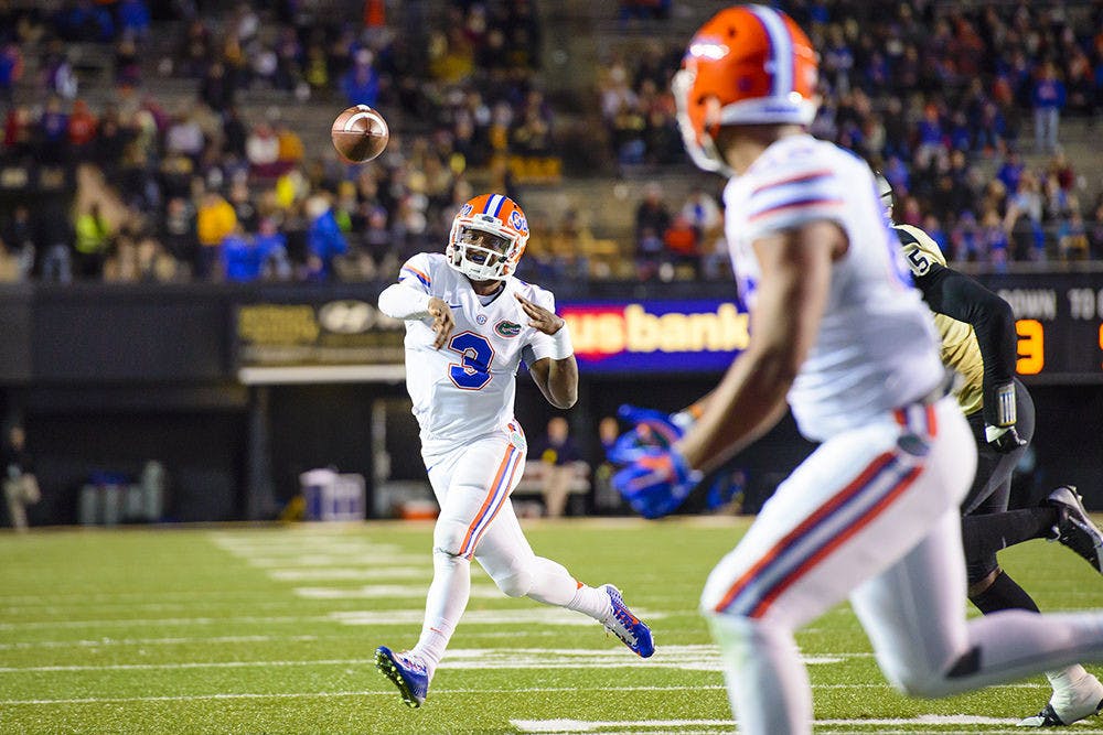 <p>Treon Harris attempts a pass during Florida's 34-10 win against Vanderbilt on Saturday in Nashville, Tennessee.</p>