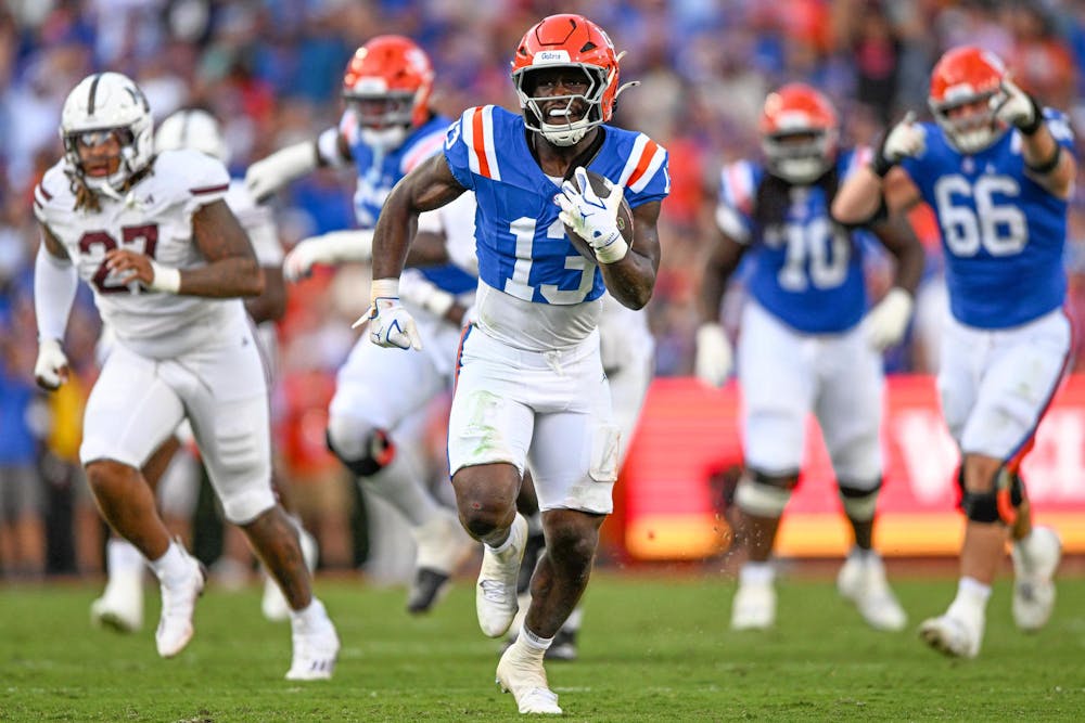 Florida Gators running back Jadan Baugh (13) runs with the ball in a NCAA college football game, Saturday, Oct. 18, 2025, in Gainesville, Fla.