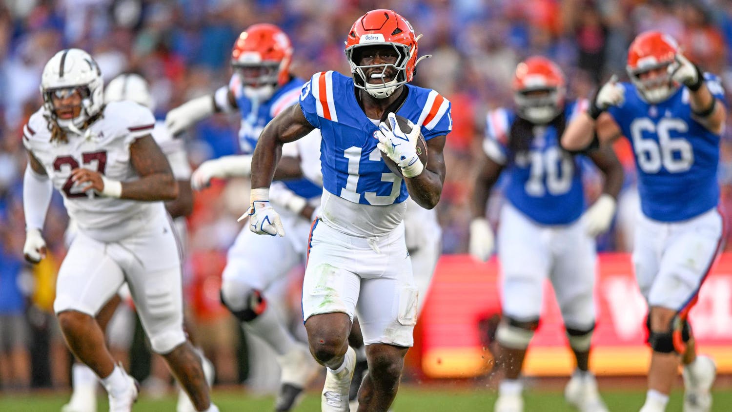 Florida Gators running back Jadan Baugh (13) runs with the ball in a NCAA college football game, Saturday, Oct. 18, 2025, in Gainesville, Fla.