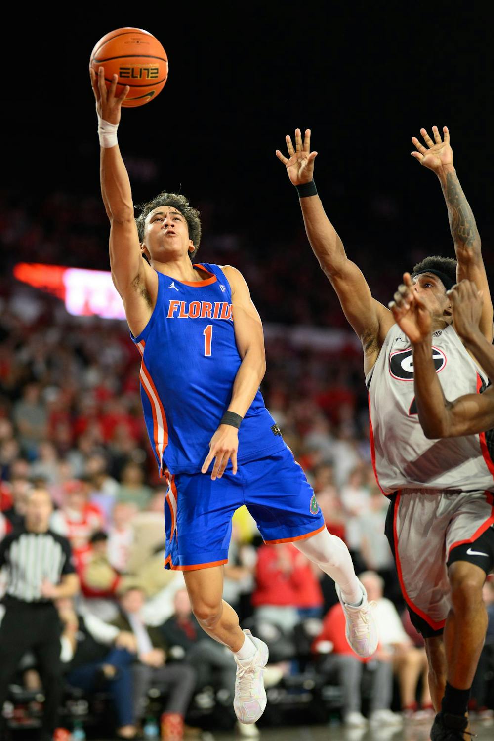 Florida guard Xaivian Lee (1) shoots a layup during the first half of an NCAA college basketball game against Georgia, Wednesday, Feb. 11, 2026, in Athens, Ga.