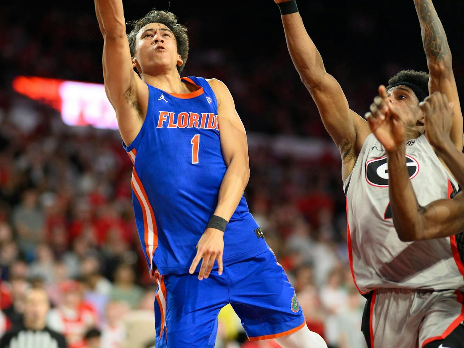 Florida guard Xaivian Lee (1) shoots a layup during the first half of an NCAA college basketball game against Georgia, Wednesday, Feb. 11, 2026, in Athens, Ga.