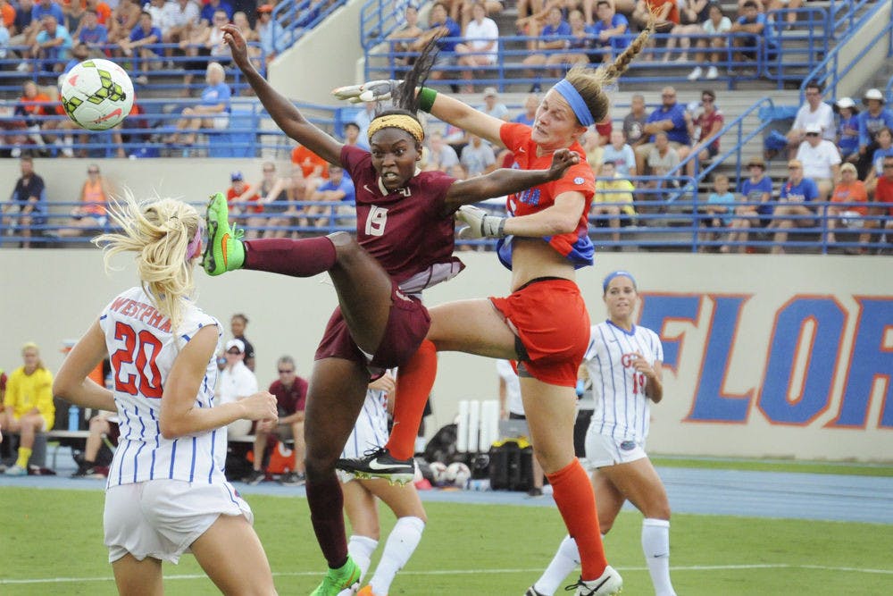 <p>UF goalkeeper Val Tysinger (right) battles for possession with FSU forward Cheyna Williams (19) during Florida's 3-2 win on Aug. 30, 2015,&nbsp;at James G. Pressly Stadium.</p>