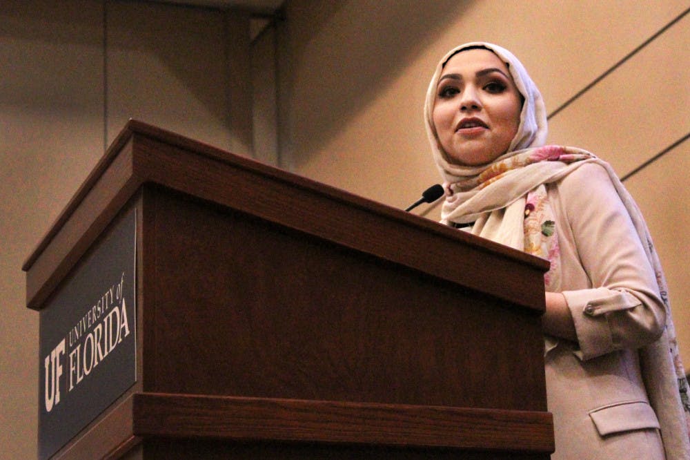 Isra Chaker, an Islamic activist and advisor for the refugee awareness campaign at Oxfam America, addresses the crowd in the Reitz Grand Ballroom Wednesday night at the Hijab-A-Thon After Hours event hosted by UF’s Islam on Campus. The event was founded to promote the meaning of the hijab and what it means to those who wear it every day. When explaining why she chose to wear her hijab after the events of Sept. 11, Chaker said, “I believed in the hijab. I saw the beauty in it.”