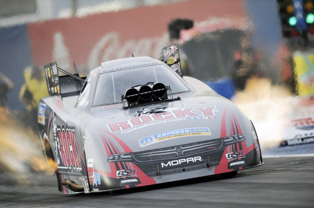 Funny Car driver Matt Hagan races down the quarter-mile track at the CarQuest Auto Parts Nationals in Phoenix.