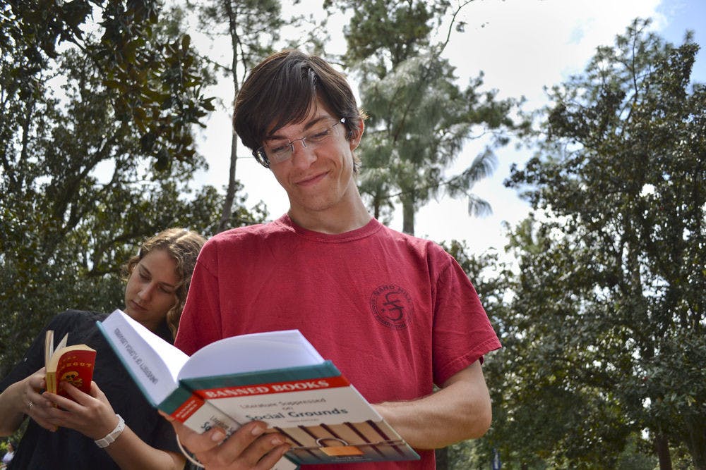 Max Dunevitz, a 19-year-old electrical engineering sophomore, thumbs though “Literature Suppressed on Social Grounds” by Dawn B. Sova at Banned Book Week celebrations. The event was a good way to “talk about all literature without social context,” he said. “We have to think about the future of what will be banned.”