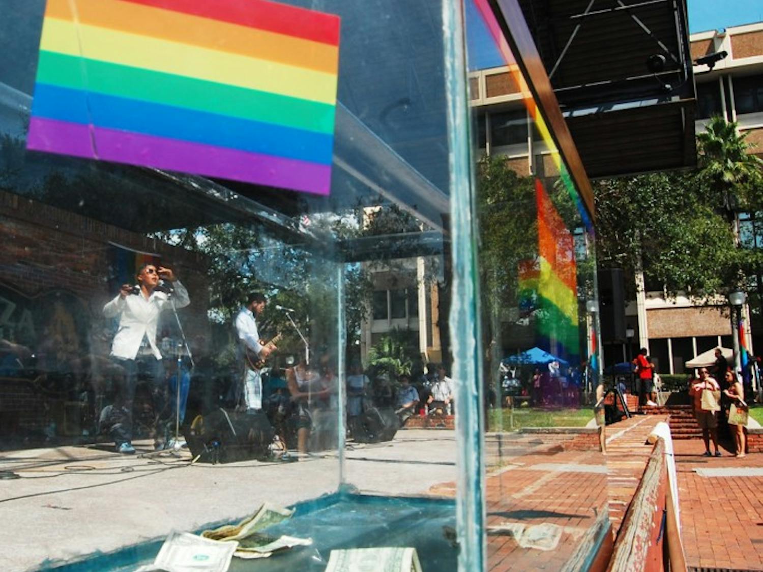 The band Captain Lovely plays on the Bo Diddley Community Plaza stage during the Pride Festival on Saturday. A collection tank was set up for people to tip the entertainers and to raise money for other LGBT events around Gainesville.
