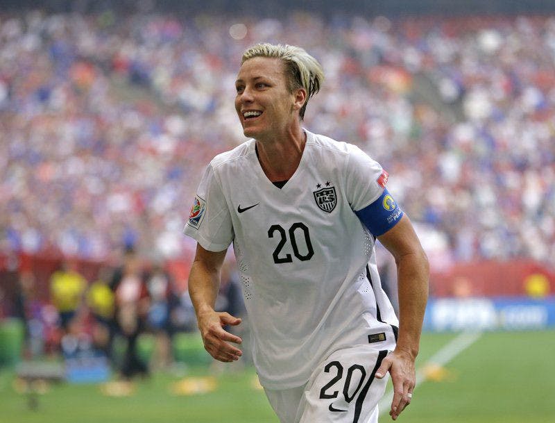 &nbsp;In this July 5, 2015, file photo, United States' Abby Wambach runs toward the stands to greet her wife after the team defeated Japan in the FIFA Women's World Cup soccer championship in Vancouver, British Columbia. Wambach has been elected to the New York State Public High School Athletic Association’s Hall of Fame. The two-time Olympic gold medalist and FIFA Women's World Cup champion heads a class that also includes coaches Andy Capellan and Charles Engel, field hockey star Tracey Fuchs, three-sport star Heidi Mann Vittengl and Section IV administrator Ben Nelson