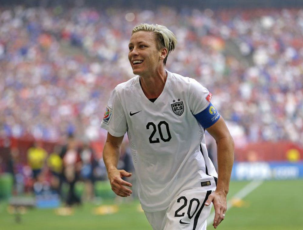 <p><span>&nbsp;In this July 5, 2015, file photo, United States' Abby Wambach runs toward the stands to greet her wife after the team defeated Japan in the FIFA Women's World Cup soccer championship in Vancouver, British Columbia. Wambach has been elected to the New York State Public High School Athletic Association’s Hall of Fame. The two-time Olympic gold medalist and FIFA Women's World Cup champion heads a class that also includes coaches Andy Capellan and Charles Engel, field hockey star Tracey Fuchs, three-sport star Heidi Mann Vittengl and Section IV administrator Ben Nelson</span></p>