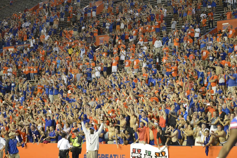 <p class="p1">Florida students and fans cheer during Florida's weather delayed game against Idaho on Saturday at Ben Hill Griffin Stadium.</p>