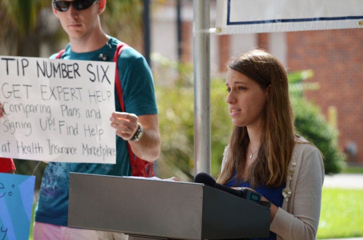 National council chair of College Democrats of America Rachel McGovern, 21, speaks about the benefits of the Affordable Care Act in front of the Infirmary on Thursday afternoon. The health care conference was held by the Florida Public Interest Research Group in hopes of informing students about the act.