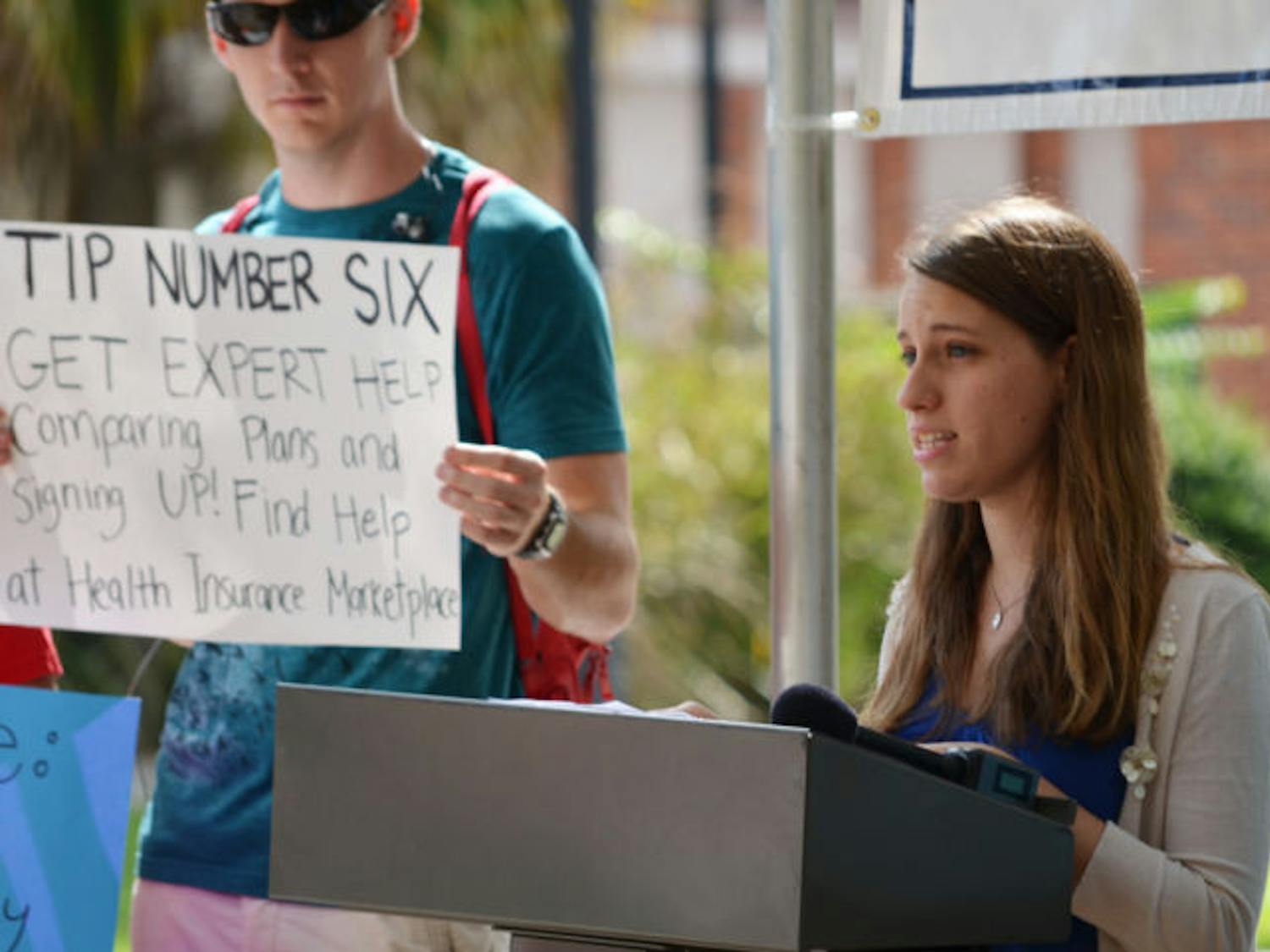National council chair of College Democrats of America Rachel McGovern, 21, speaks about the benefits of the Affordable Care Act in front of the Infirmary on Thursday afternoon. The health care conference was held by the Florida Public Interest Research Group in hopes of informing students about the act.