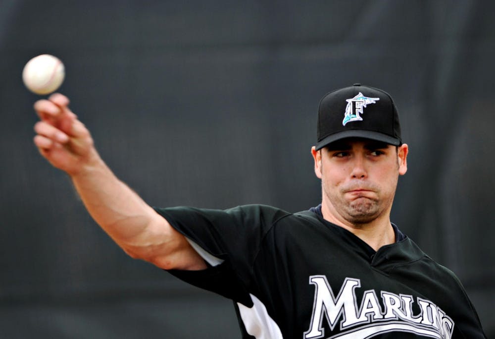 Florida Marlins closer Kevin Gregg throws during spring training baseball practice Monday in Jupiter. (AP Photo)