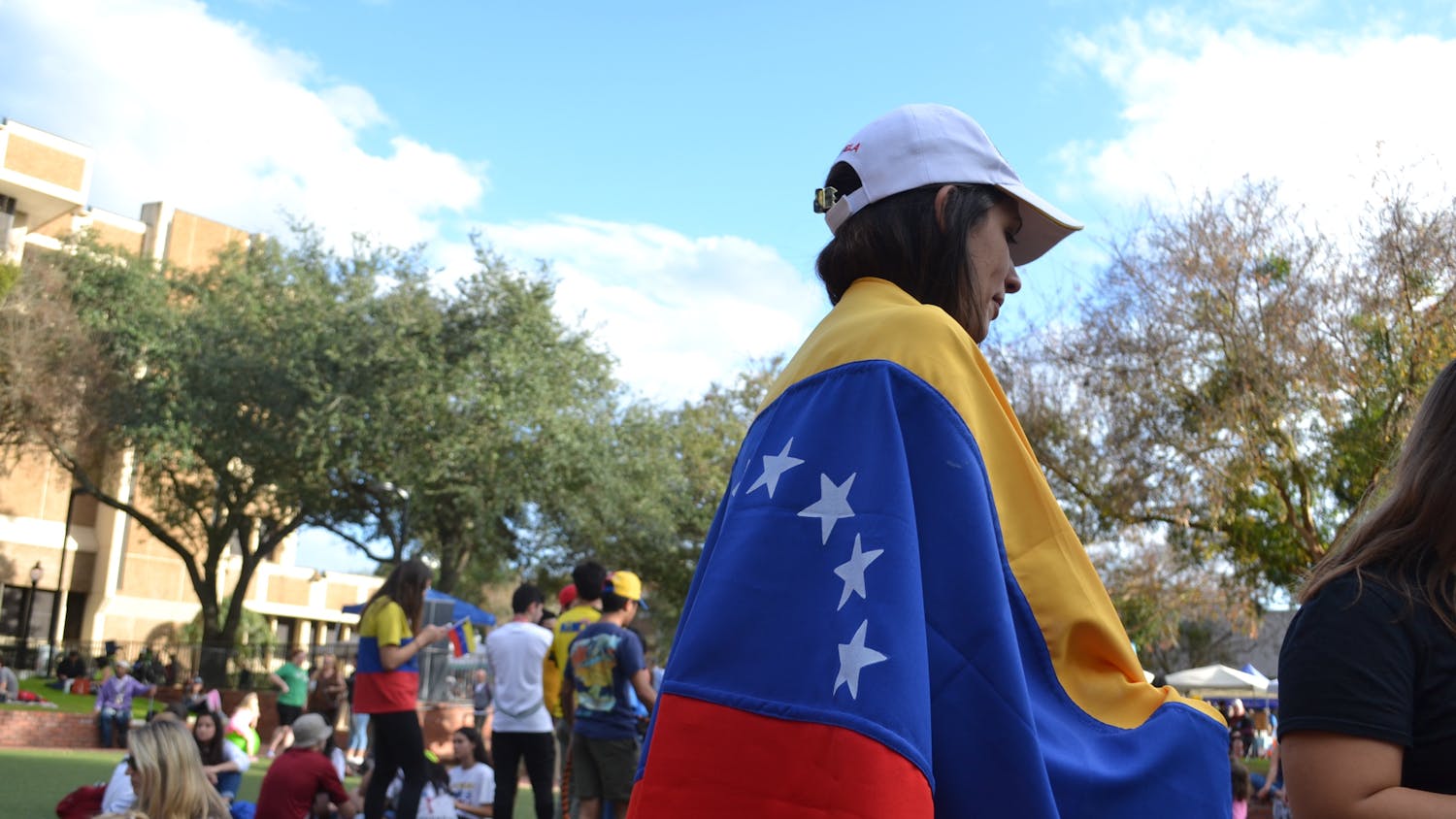 About 200 Gainesville residents demonstrated at Bo Diddley Plaza to show support for self-declared Venezuelan interim president Juan Guaidó. Edysmar Diaz-Cruz / Alligator Contributor