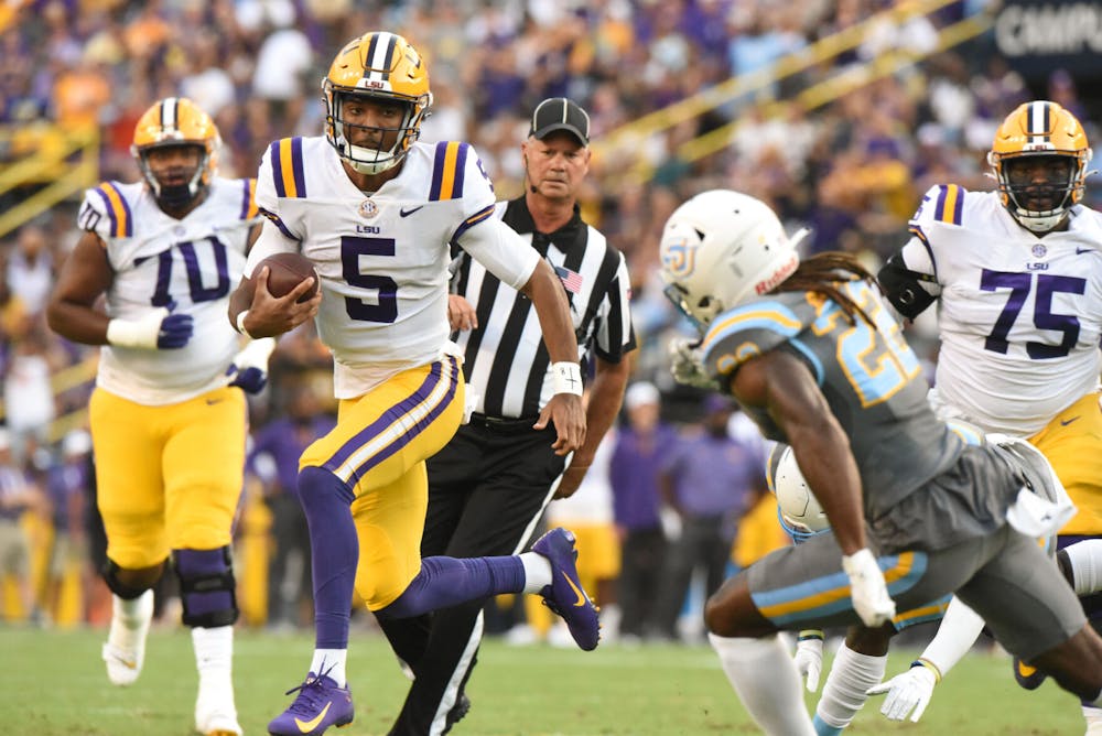 LSU football junior quarterback Jayden Daniels (5) carries the ball down the field on Saturday, Sept. 10, 2022, during LSU’s 65-17 win over Southern at Tiger Stadium in Baton Rouge, Louisiana. Photo by Chloe Kalmbach | The Reveille