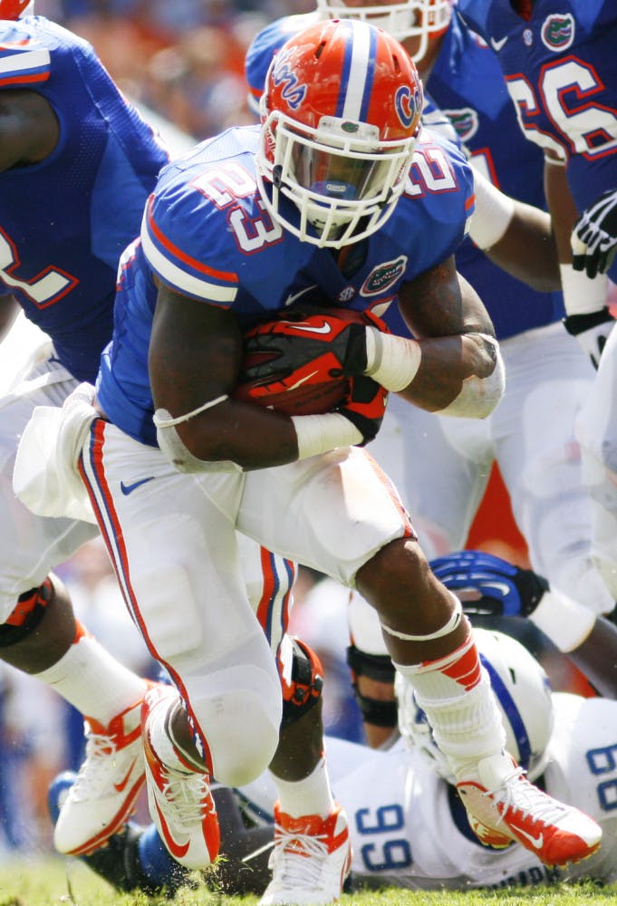 Running back Mike Gillislee (23) runs through the Kentucky defense during Florida's 38-0 win at Ben Hill Griffin Stadium on Sept. 22. Florida faces the ninth-ranked rushing defense in the country in LSU on Saturday.