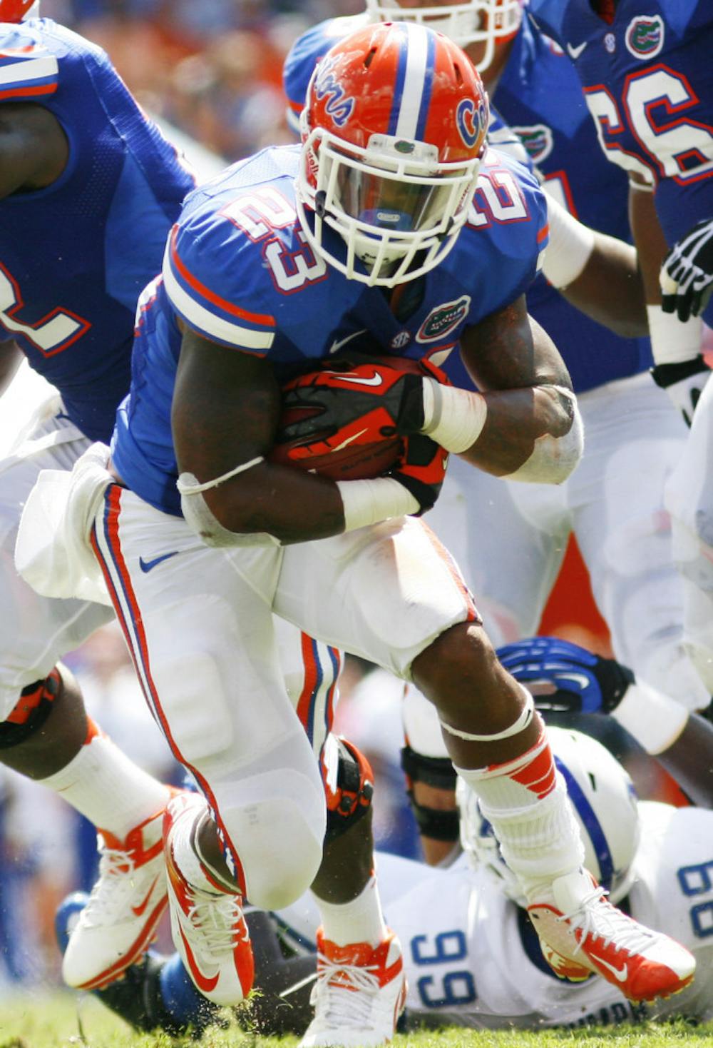 <p>Running back Mike Gillislee (23) runs through the Kentucky defense during Florida's 38-0 win at Ben Hill Griffin Stadium on Sept. 22. Florida faces the ninth-ranked rushing defense in the country in LSU on Saturday.</p>