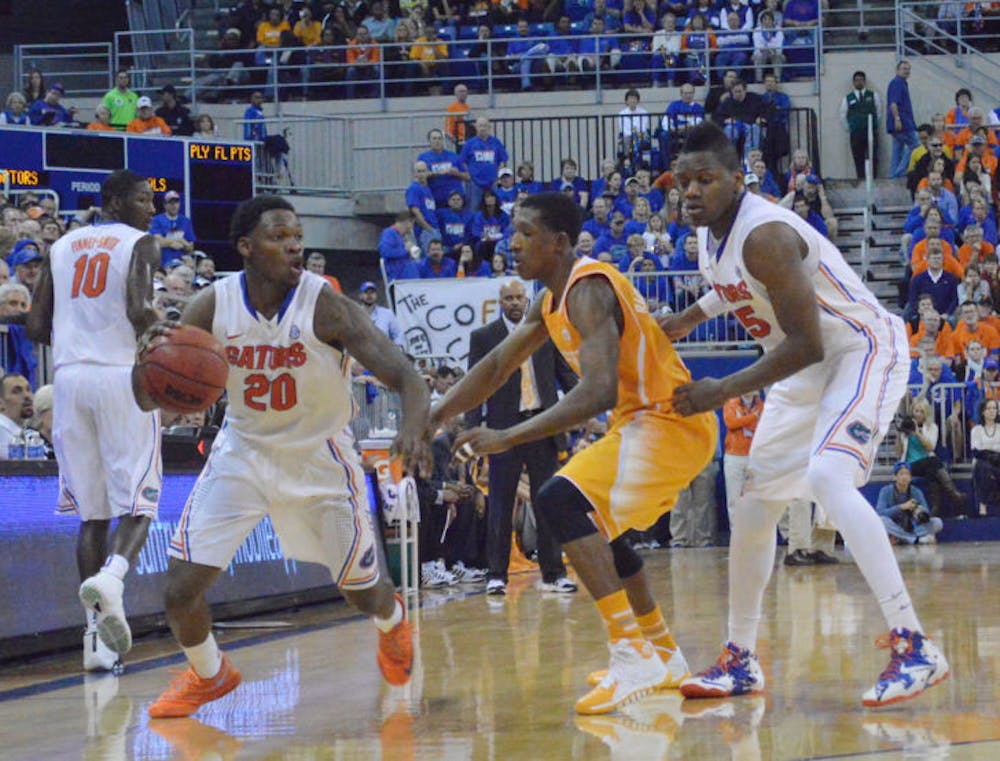 <p>Michael Frazier II drives the ball down the court during Florida’s 67-41 win against Tennessee on Saturday in the O’Connell Center. Frazier led the Gators with 17 points against the Volunteers.</p>