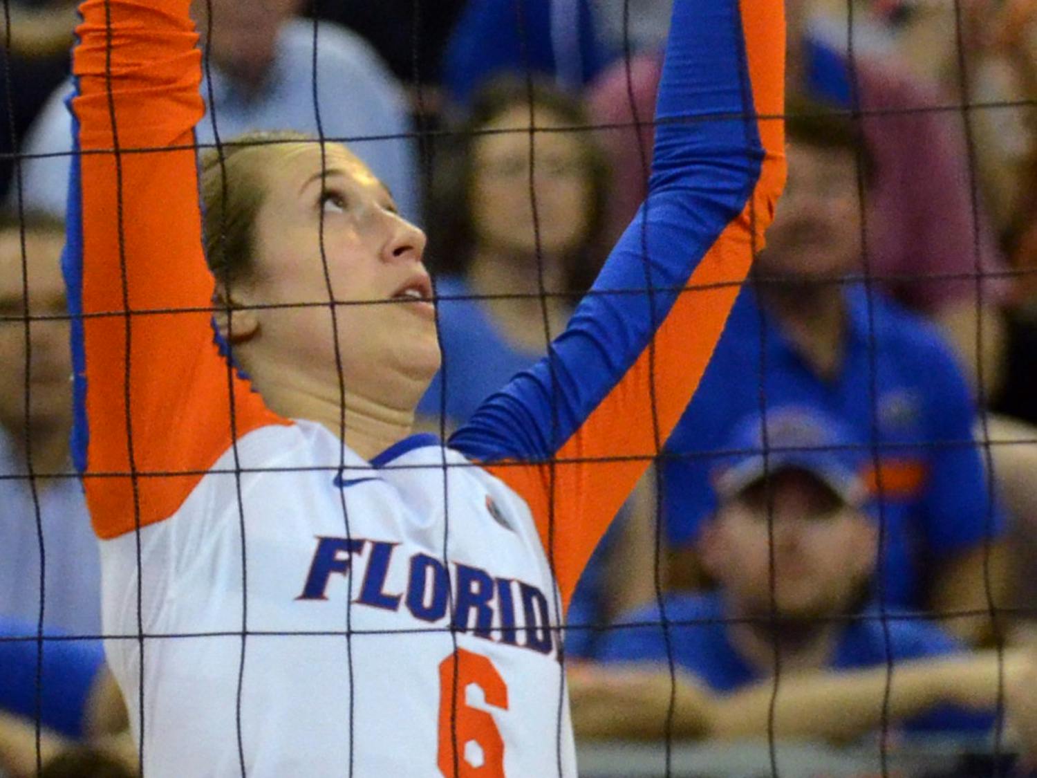 Mackenzie Dagostino sets the ball during No. 8 seed Florida's 3-1 win against Miami in the second round of the NCAA Tournament on Dec. 6, 2014, in the O'Connell Center.