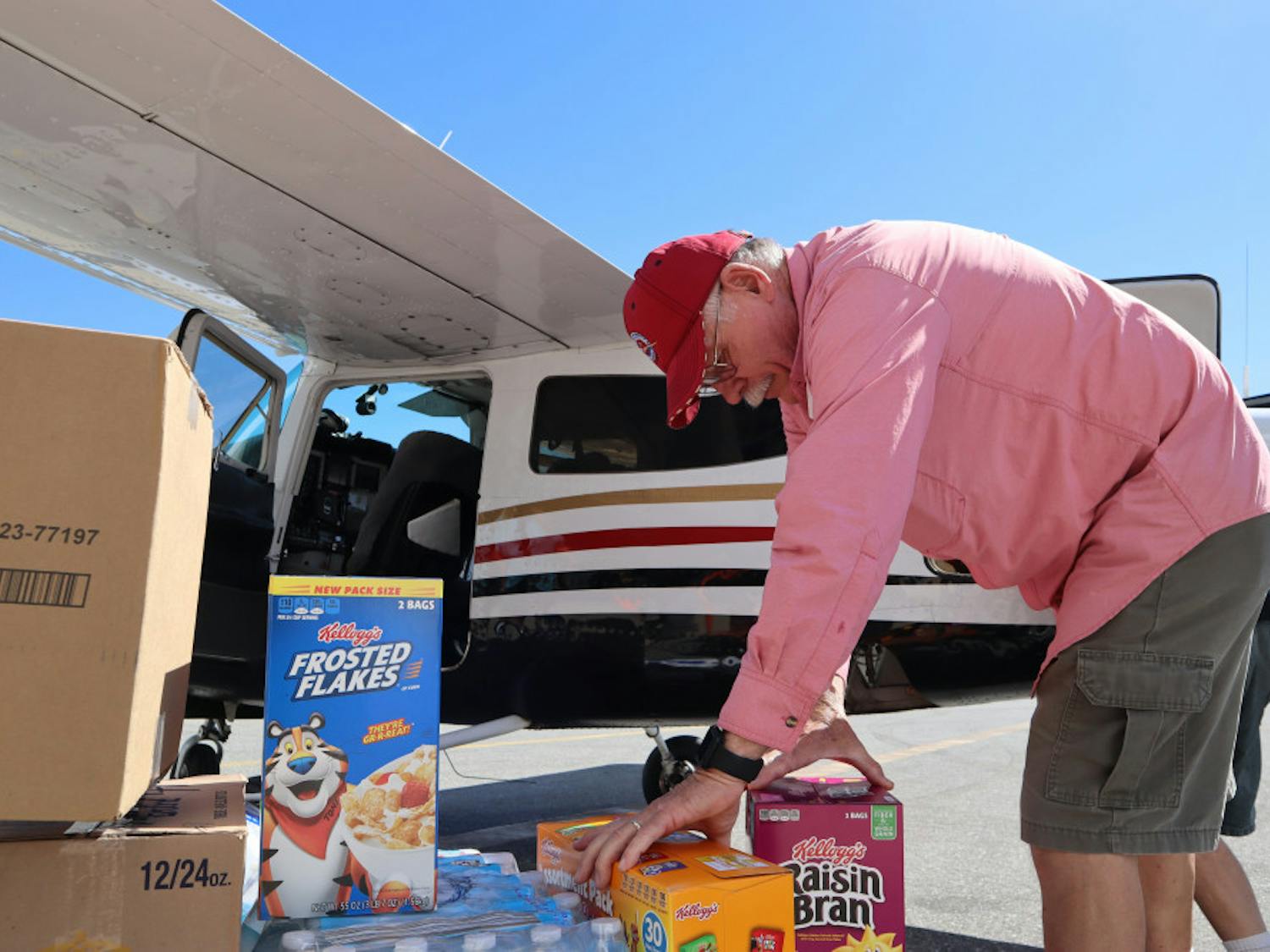 Pilot Mark Creighton, of Port Aransas, Texas, loads nonperishable food onto a plane headed to Appalachia, Florida, for Operation Airdrop. His home flooded during Hurricane Harvey, and he’s helped other victims of hurricanes through Operation Airdrop since.