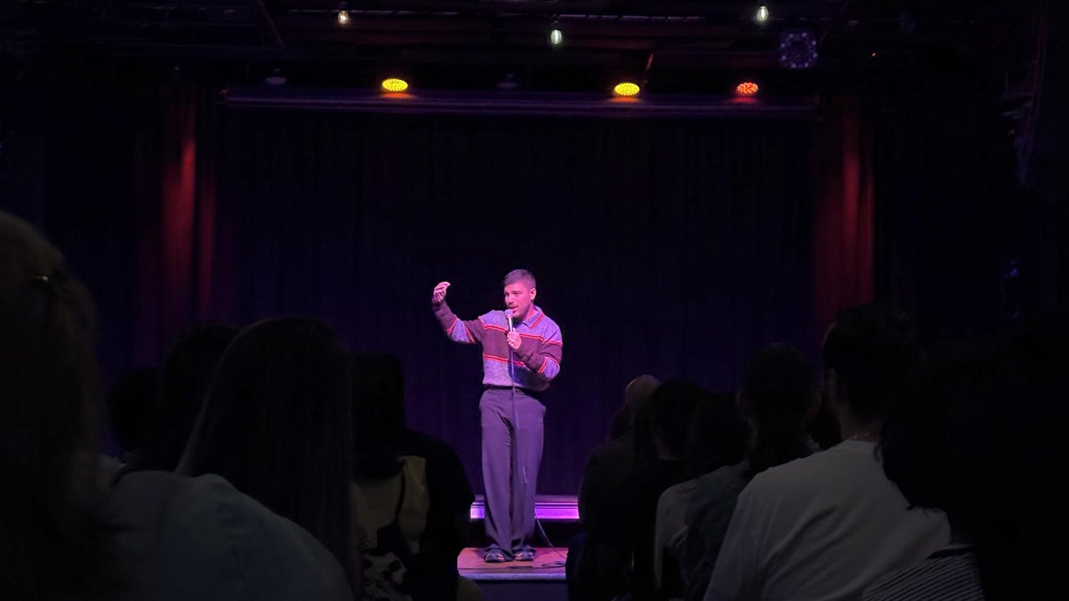 Comedian Angelo Molina performs on stage at The Wooly March 6, 2026 in Gainesville, Fla.
