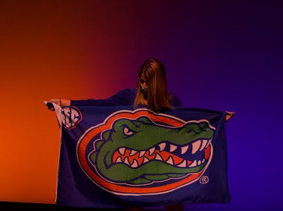 Photo of pageant contestant holding a Gators flag