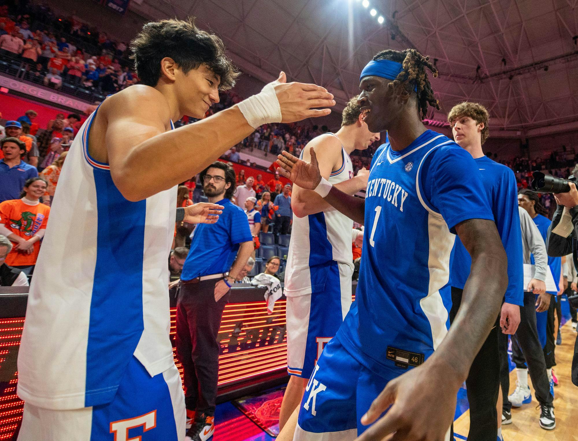 Kentucky guard Denzel Aberdeen (1) goes to hug Florida guard Xaivian Lee (1) after losing an NCAA college basketball game, Saturday, Feb. 14, 2026 at Exactech Arena in Gainesville, Fla.