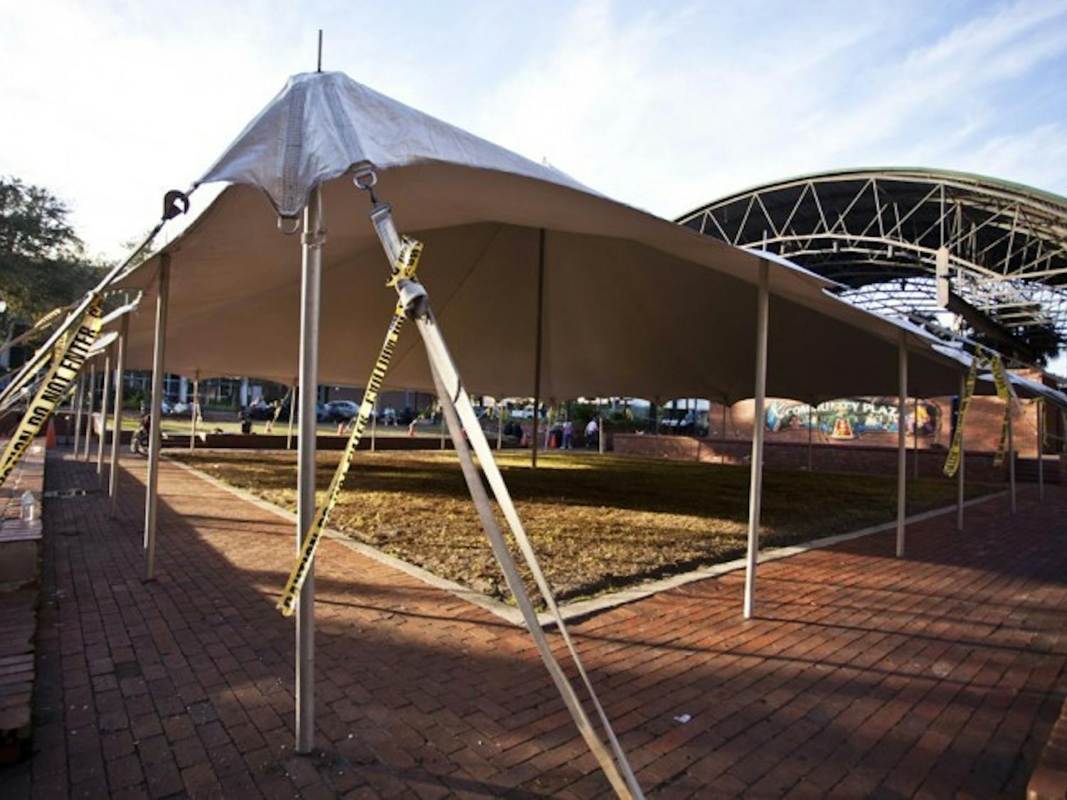 Technical problems have forced the abandonment of efforts to construct an ice rink downtown on Bo Diddley Plaza. The white tarp pitched above the plaza's grassy pit was the only remnant from the rink Sunday afternoon.