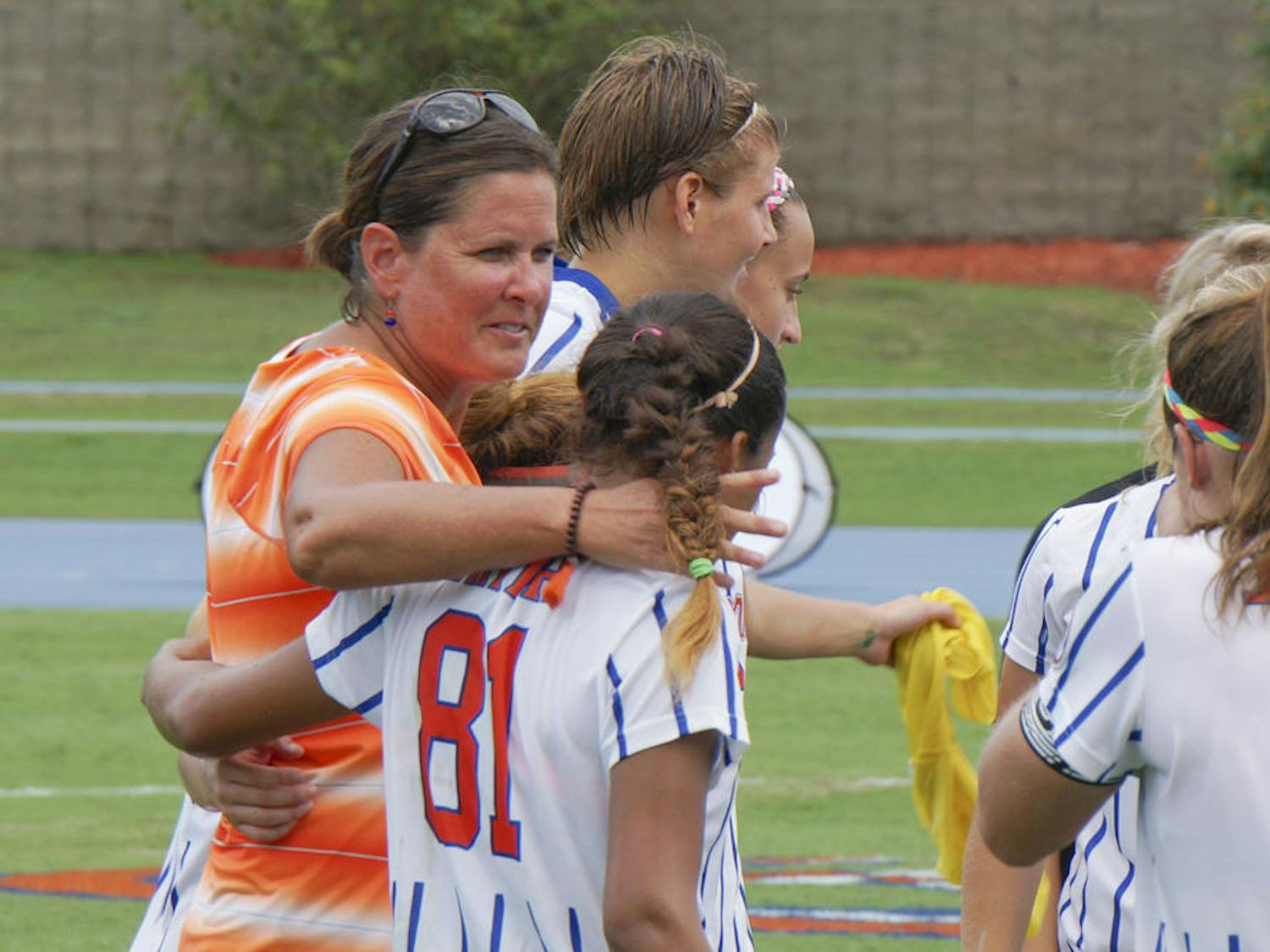 UF soccer coach Becky Burleigh puts her arm around defender Rachelle Smith (81) following Florida's 3-2 win against Florida Sate on Aug. 30, 2015, at James G. Pressly Stadium.