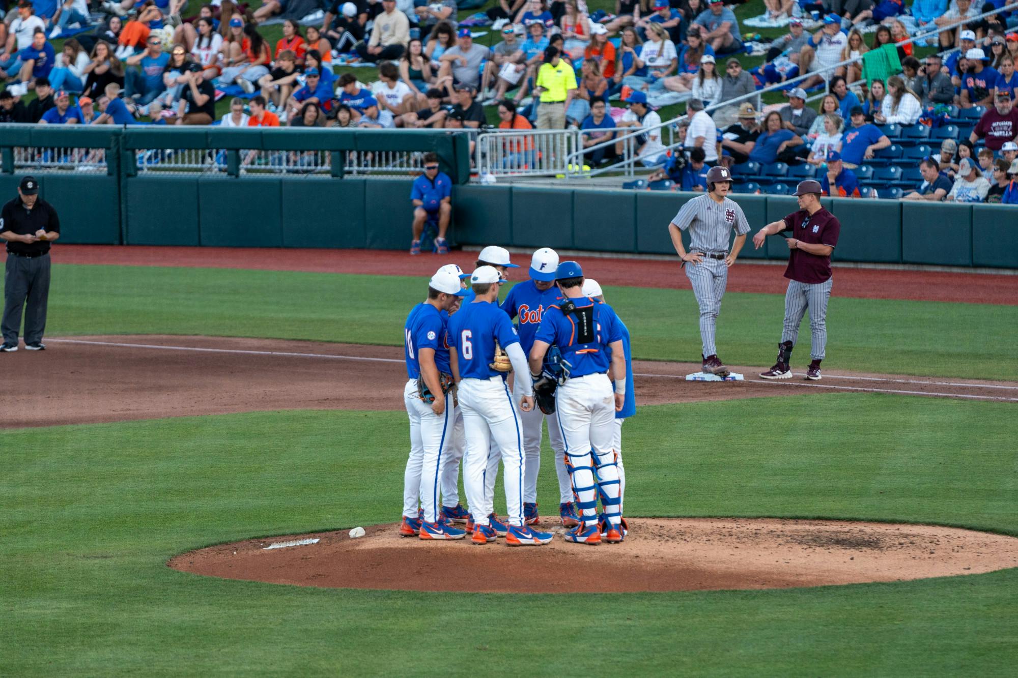 Florida baseball head coach Kevin O'Sullivan takes a mound visit in the team's 12-2 loss to the Mississippi State Bulldogs Saturday, March 30, 2024. 