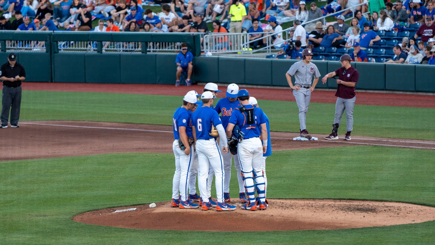 Florida baseball head coach Kevin O'Sullivan takes a mound visit in the team's 12-2 loss to the Mississippi State Bulldogs Saturday, March 30, 2024. 