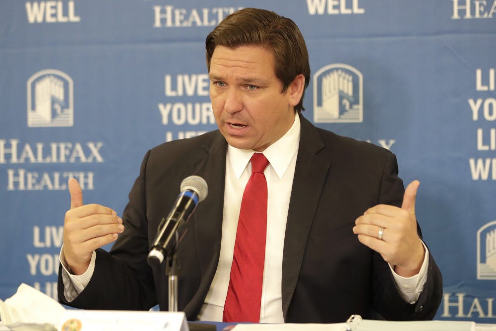 <p>Florida Gov. Ron DeSantis speaks at a news conference at Halifax Health Medical Center Sunday, May 3, 2020, in Daytona Beach, Fla. Business owners across much of Florida were busy Sunday preparing to reopen Monday under new restrictions. Gov. Ron DeSantis said he’s deliberately taking things slowly during re-opening. (AP Photo/John Raoux)</p>