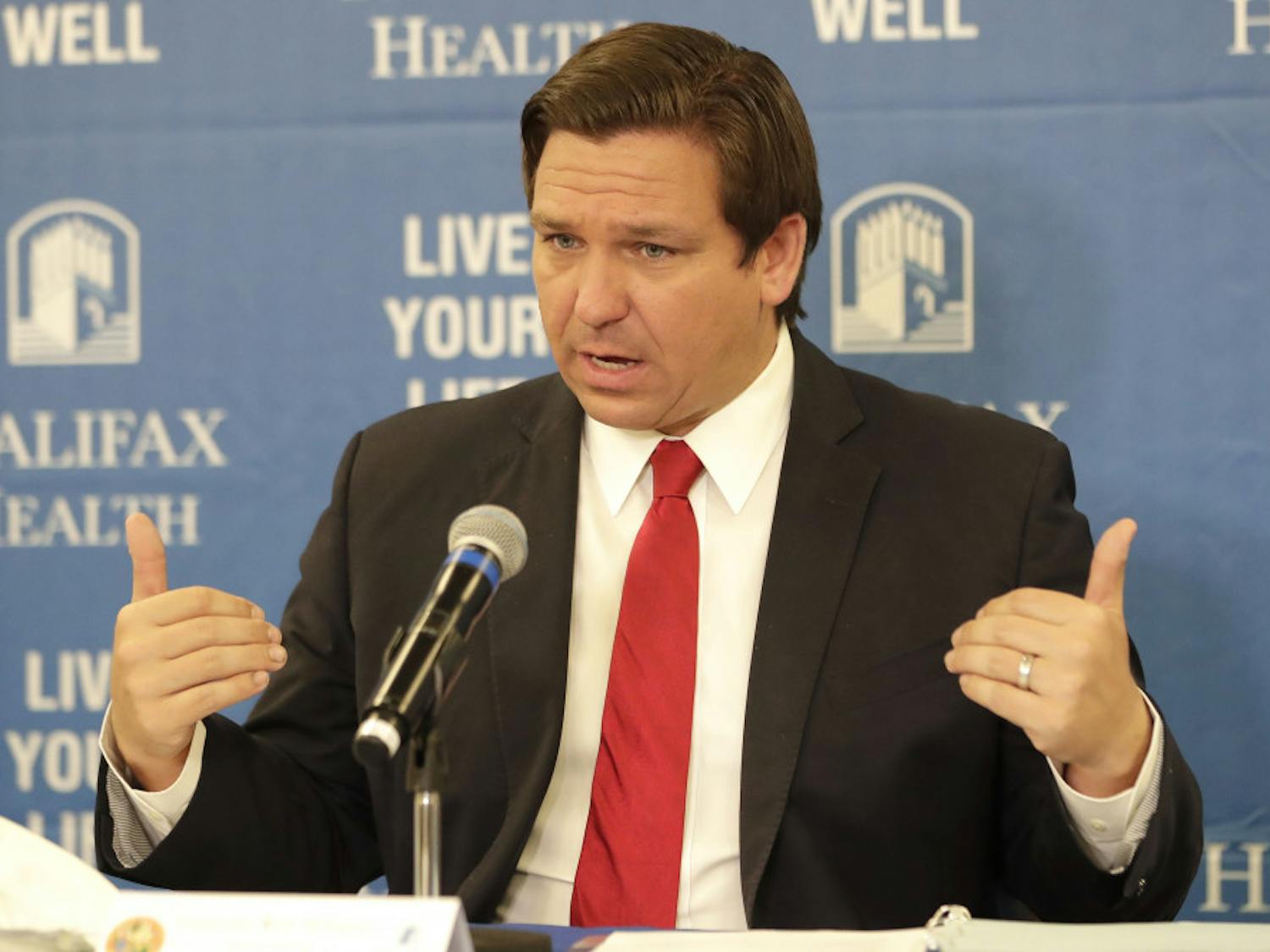 Florida Gov. Ron DeSantis speaks at a news conference at Halifax Health Medical Center Sunday, May 3, 2020, in Daytona Beach, Fla. Business owners across much of Florida were busy Sunday preparing to reopen Monday under new restrictions. Gov. Ron DeSantis said he’s deliberately taking things slowly during re-opening. (AP Photo/John Raoux)