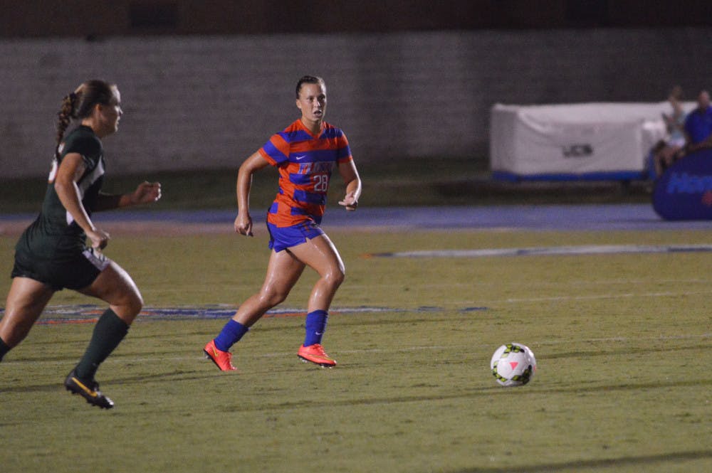 Sophomore midfielder Meggie Dougherty Howard runs toward the ball during Florida's 3-0 win against Miami on August 22, 2014, at James G. Pressly Stadium.