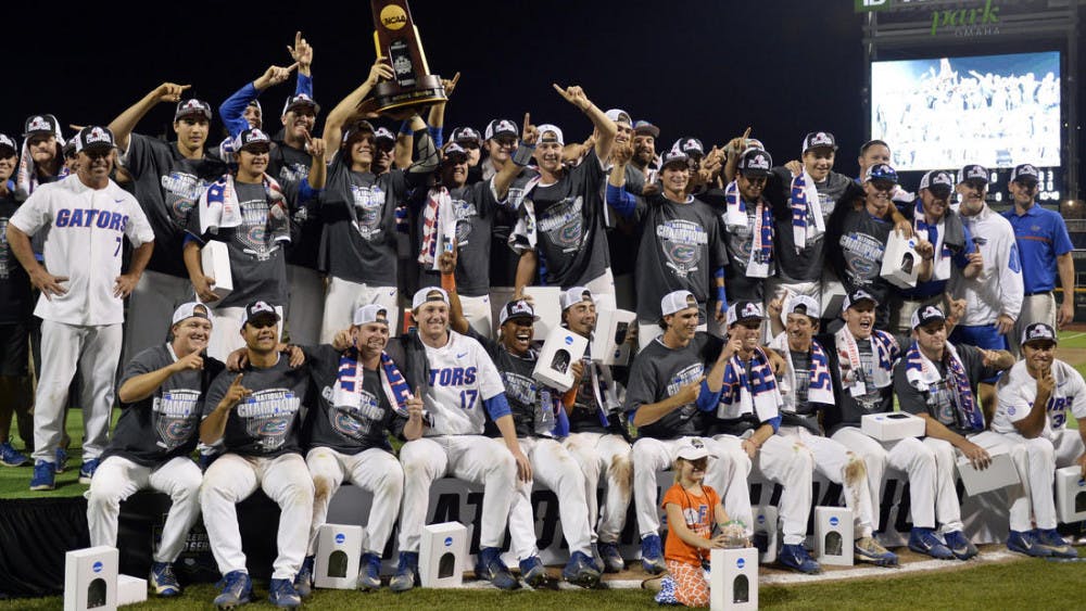 <p>The Florida baseball team celebrates with the national championship following its 6-1 win over LSU in Game 2 of the College World Series Finals on Tuesday in Omaha, Nebraska. </p>