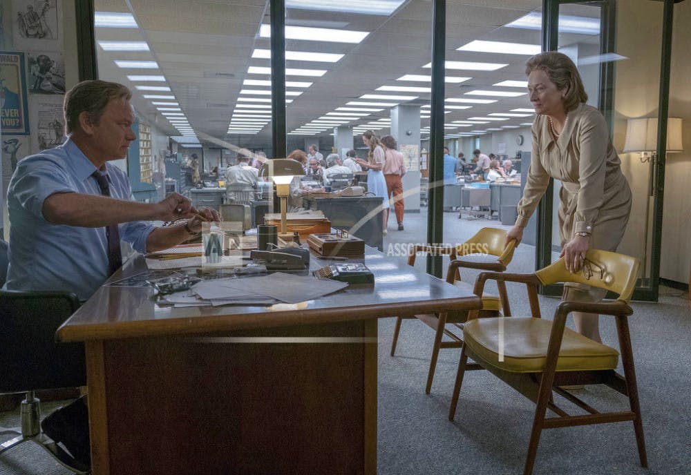 In this image released by 20th Century Fox, Tom Hanks portrays Ben Bradlee, left, and Meryl Streep portrays Katharine Graham in a scene from "The Post." (Niko Tavernise/20th Century Fox via AP)