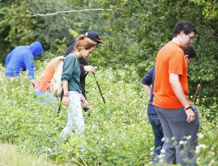 UF student volunteers search for 18-year-old UF freshman Christian Aguilar in the woods off of Southwest 20th Avenue next to Canopy Apartments. Aguilar has been missing since Sept. 20.