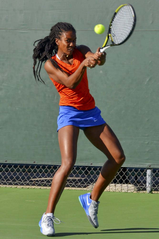 Brianna Morgan hits a two-handed backhand during Florida's 4-0 win against Elon on Saturday at the Ring Tennis Complex.
