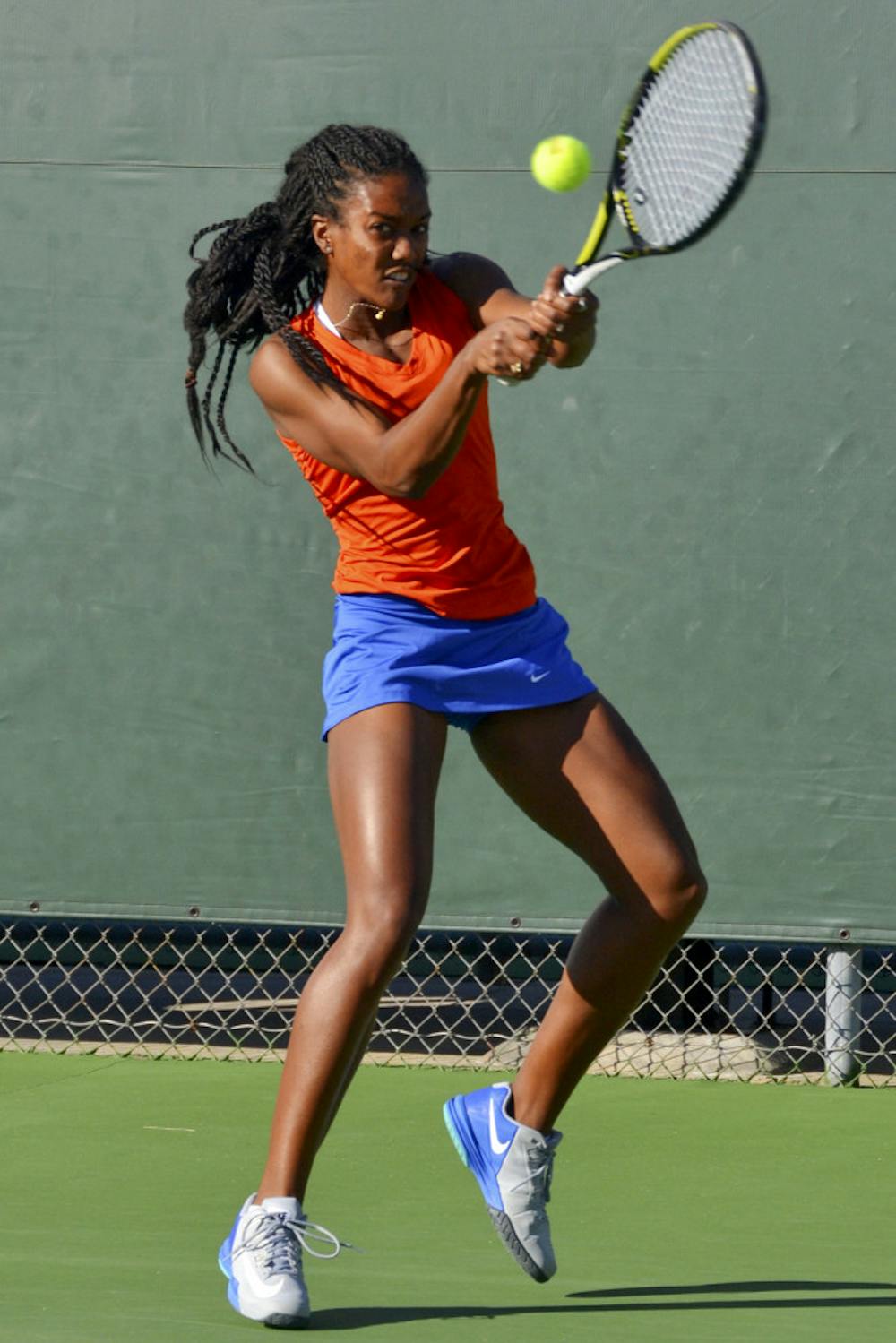 <p>Brianna Morgan hits a two-handed backhand during Florida's 4-0 win against Elon on Saturday at the Ring Tennis Complex.</p>