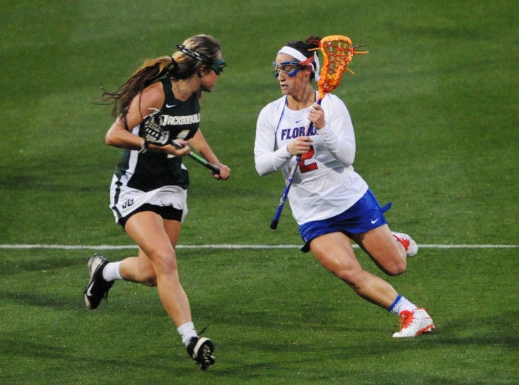 Sammi Burgess runs toward the net during Florida’s 21-5 win against Jacksonville on Feb. 12 at Donald R. Dizney Stadium.