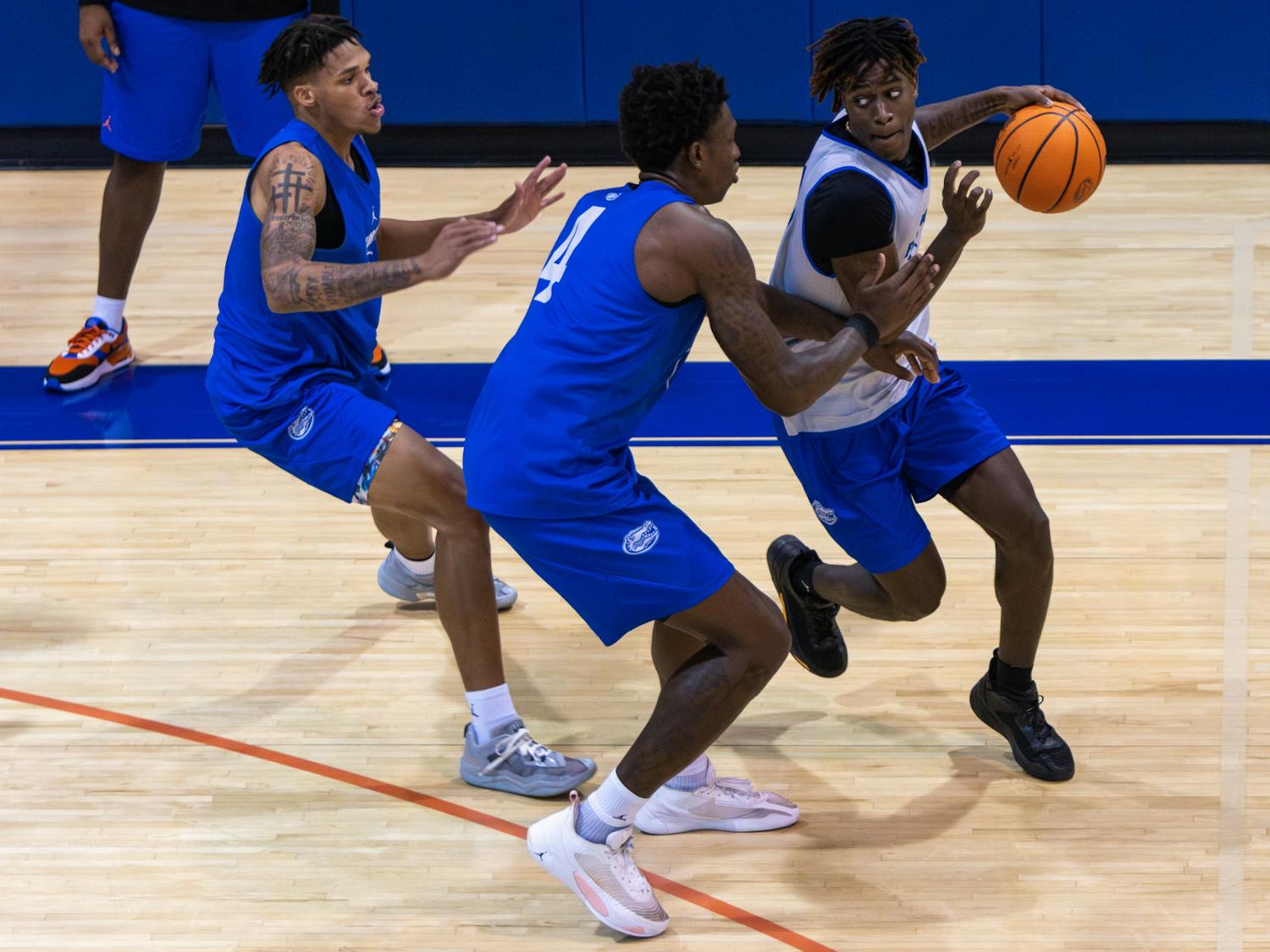 Sophomore guard Denzel Aberdeen goes against two defenders in the Gators’ open practice on Tuesday, Sept. 26, 2023.  