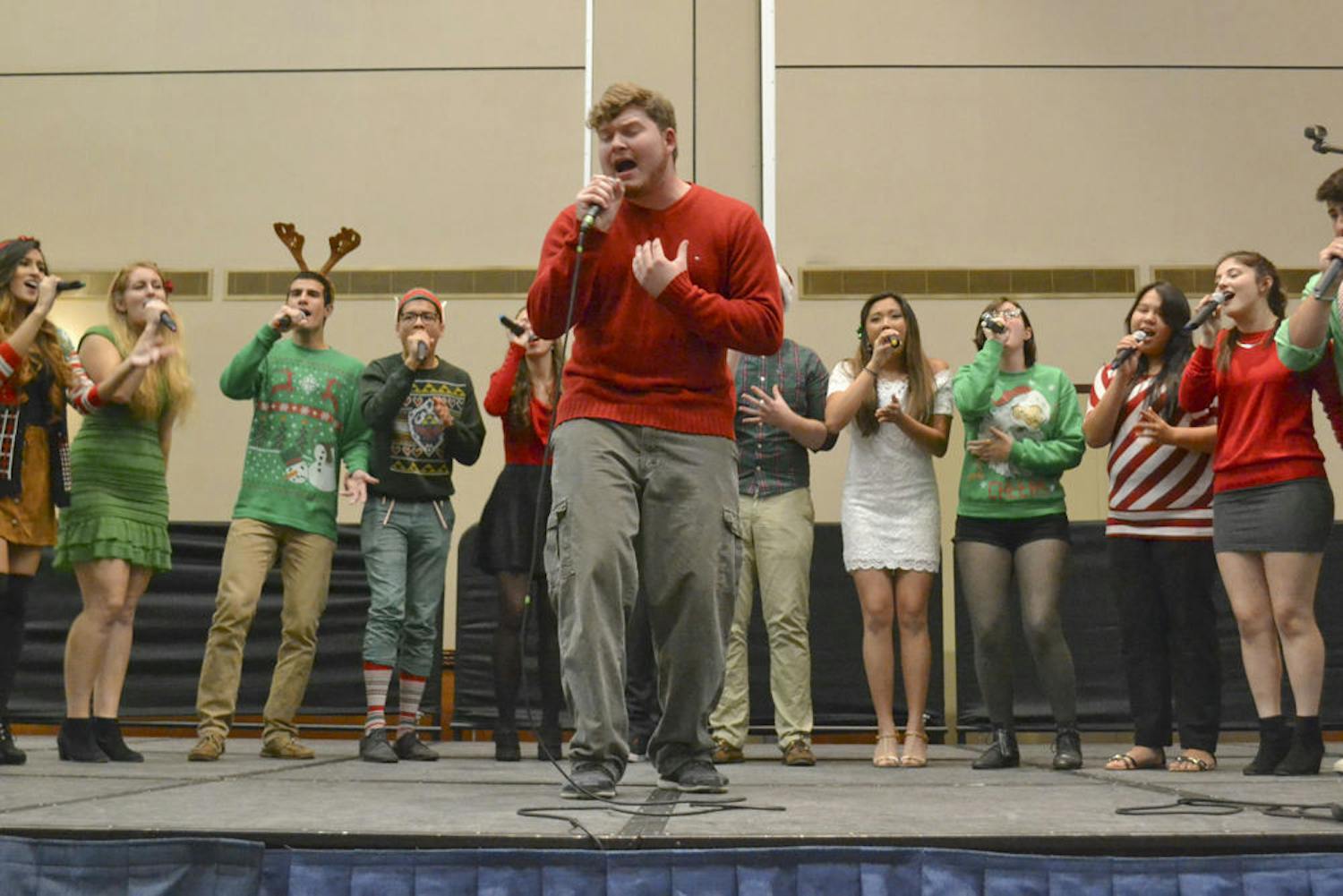 John Nyren, a 22-year-old UF computer science senior, belts out “Lay Me Down” by Sam Smith with the UF a capella group Tone Deaf at the annual “Falala Cappella” concert in the Reitz Grand Ballroom on Dec. 7, 2015. Nyren has been with the group one semester and already says he “loves them like family.”