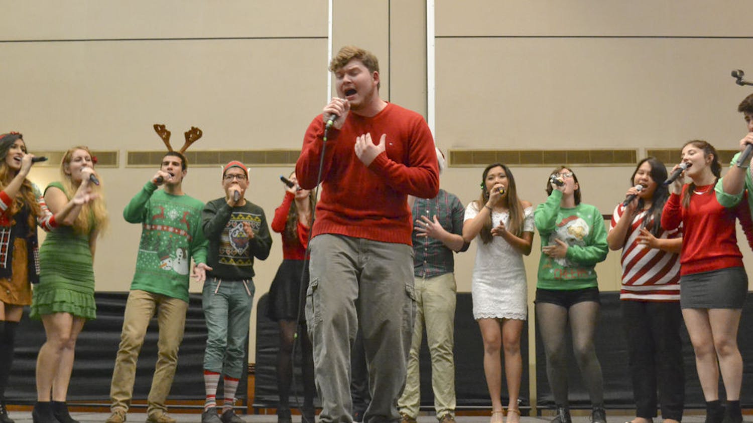 John Nyren, a 22-year-old UF computer science senior, belts out “Lay Me Down” by Sam Smith with the UF a capella group Tone Deaf at the annual “Falala Cappella” concert in the Reitz Grand Ballroom on Dec. 7, 2015. Nyren has been with the group one semester and already says he “loves them like family.”