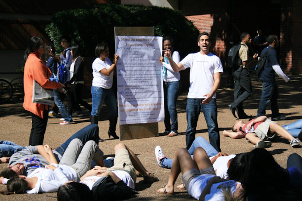 <p>About 15 students drop down onto the pavement in the middle of Turlington Plaza on Tuesday afternoon, representing the students who drop out of high school every 26 seconds in the U.S. Read the story at alligator.org.</p>