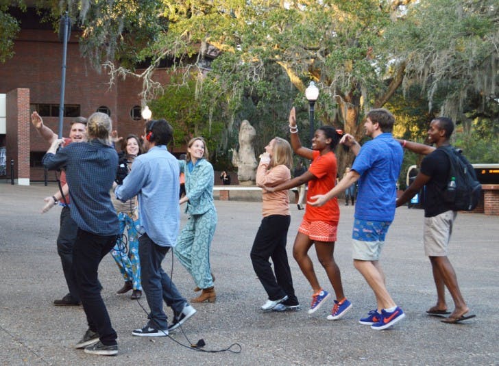 Students reenact the old UF tradition of the impromptu pajama parade, which freshmen would participate in, for a Reese’s video. Reese’s is visiting campuses across the country to make videos about college traditions.