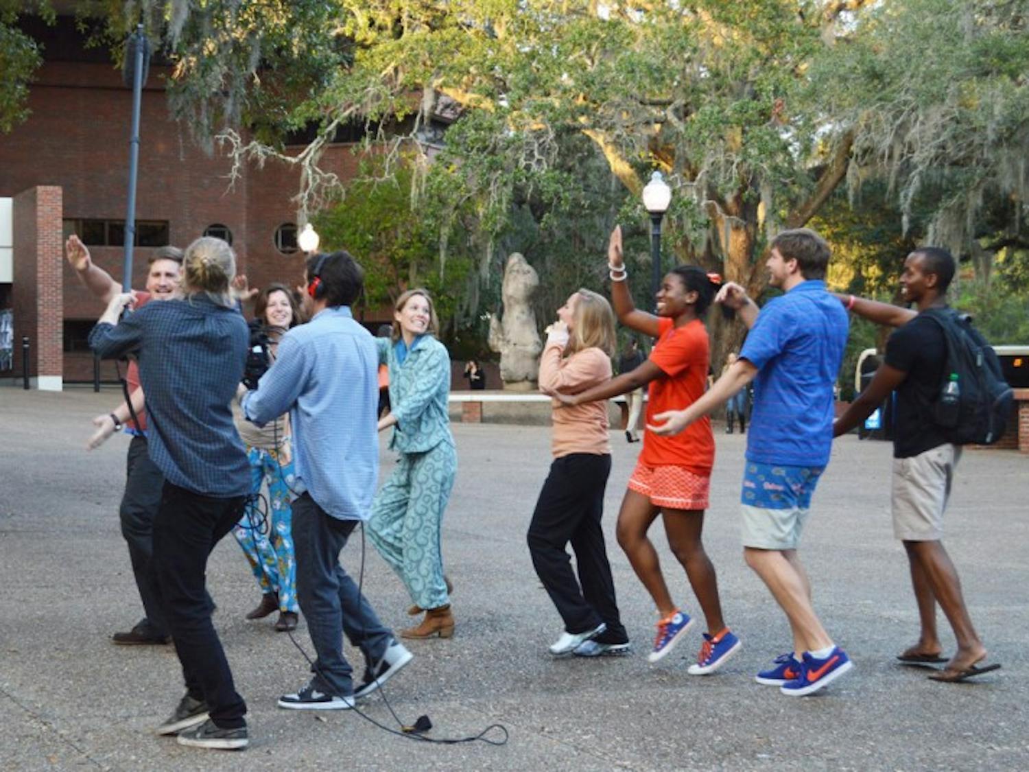 Students reenact the old UF tradition of the impromptu pajama parade, which freshmen would participate in, for a Reese’s video. Reese’s is visiting campuses across the country to make videos about college traditions.