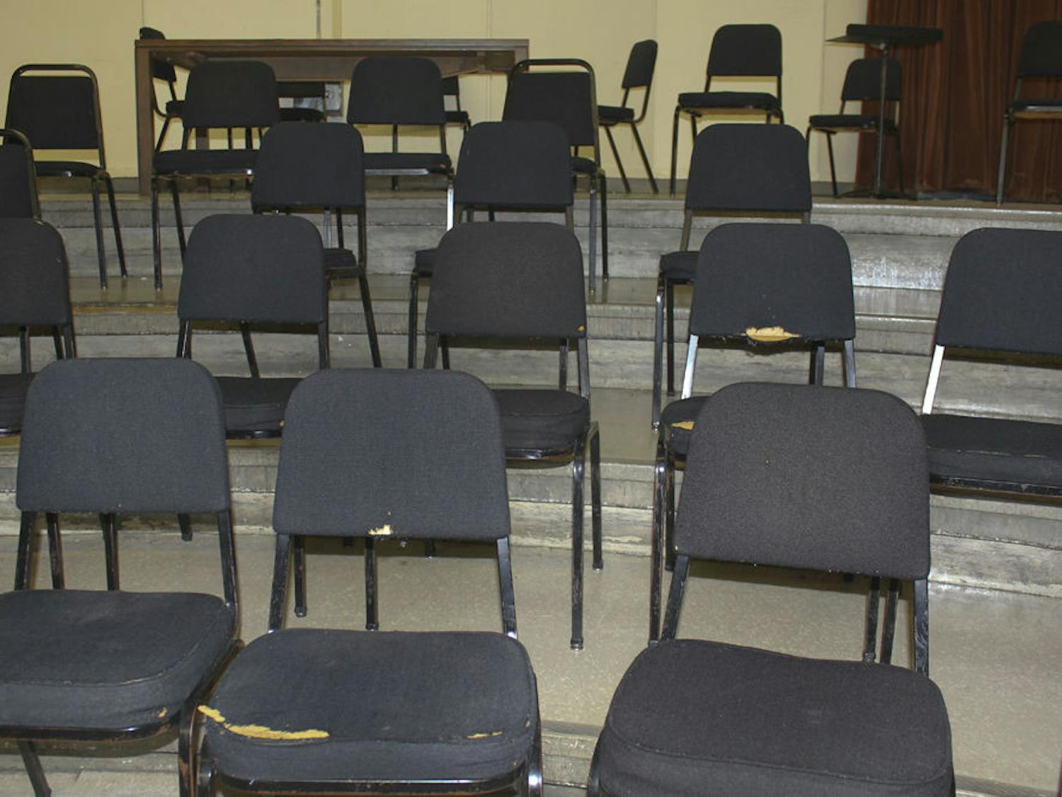 Some of these chairs have been in the building since it first opened as the College of the Fine Arts in 1943. Torn and leaking cushion foam, they are still used for lectures and recitals.